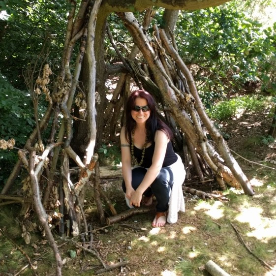 Fabula Copy's Rachael Kelly in a twig hut